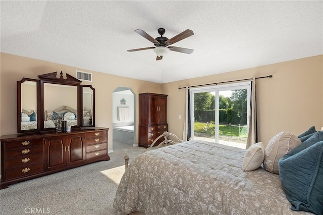 323 N Hacienda Ave, Glendora, CA 91741 - bedroom with access to outside, light colored carpet, arched walkways, ceiling fan, and a textured ceiling