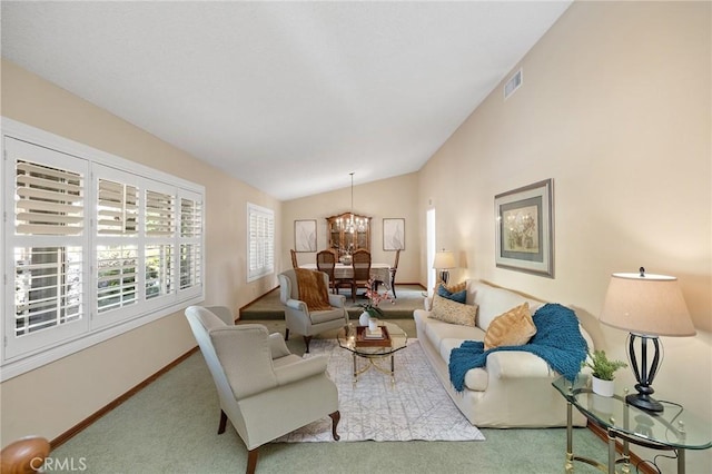 323 N Hacienda Ave, Glendora, CA 91741 - carpeted living room featuring lofted ceiling and a chandelier