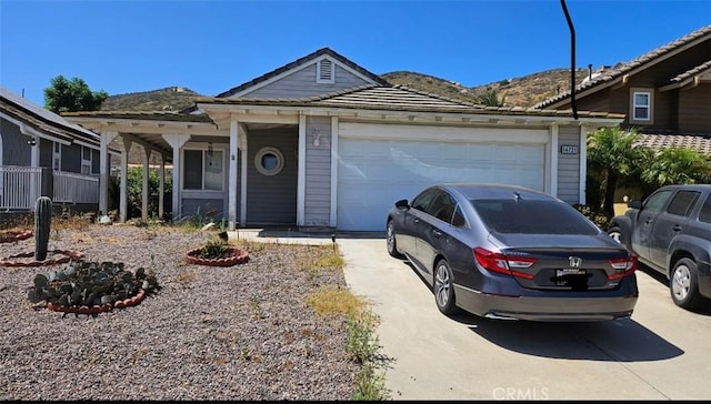 14721 Weeping Willow Ln, Fontana, CA 92337 - ranch-style home with concrete driveway, a garage, and a tiled roof