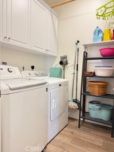 7676 Nectarsweet Dr, Riverside, CA 92507 - washroom featuring washing machine and dryer, cabinet space, and light wood-style flooring