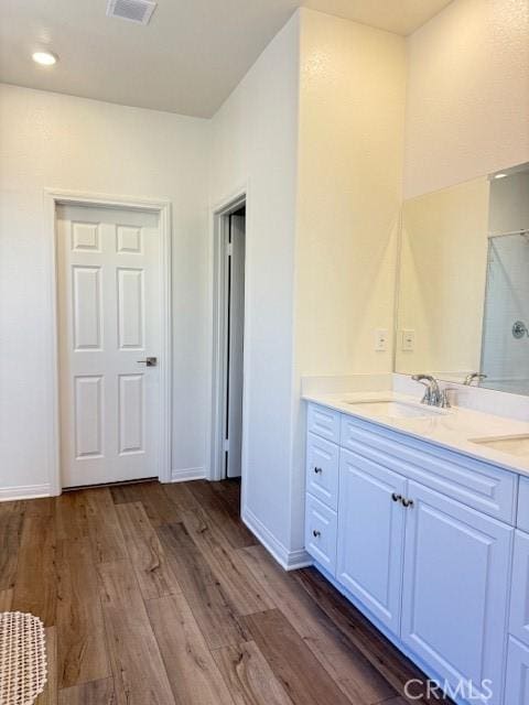 7676 Nectarsweet Dr, Riverside, CA 92507 - full bath featuring double vanity, a shower with shower door, wood finished floors, and recessed lighting