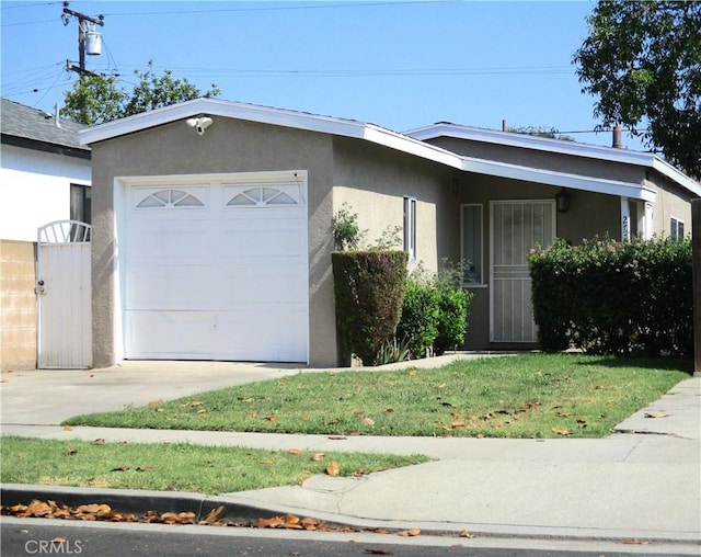 2713 E Monroe St, Long Beach, CA 90810 - view of front of home with stucco siding, driveway, an attached garage, and a gate