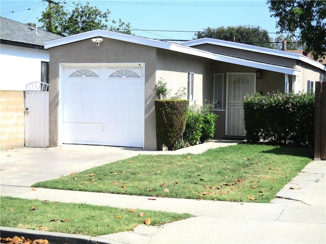 2713 E Monroe St, Long Beach, CA 90810 - ranch-style house featuring an attached garage, stucco siding, driveway, and a front lawn