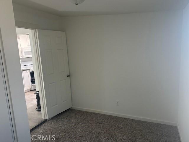 2466 W Wilson St, Banning, CA 92220 - unfurnished room with carpet and baseboards