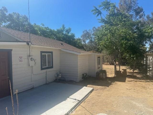 2466 W Wilson St, Banning, CA 92220 - view of side of property with a patio area