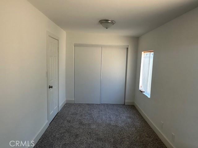 2466 W Wilson St, Banning, CA 92220 - unfurnished bedroom featuring carpet floors and a closet