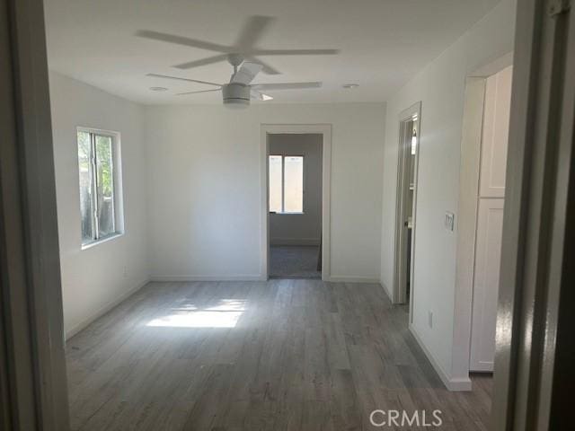 2466 W Wilson St, Banning, CA 92220 - unfurnished room with plenty of natural light, wood finished floors, and ceiling fan