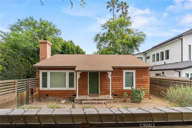 4514 Cedros Ave, Sherman Oaks, CA 91403 - view of front of home featuring a chimney, roof with shingles, and a fenced backyard