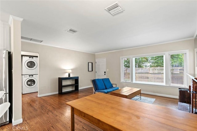 4514 Cedros Ave, Sherman Oaks, CA 91403 - office area featuring stacked washer / drying machine, ornamental molding, and wood finished floors
