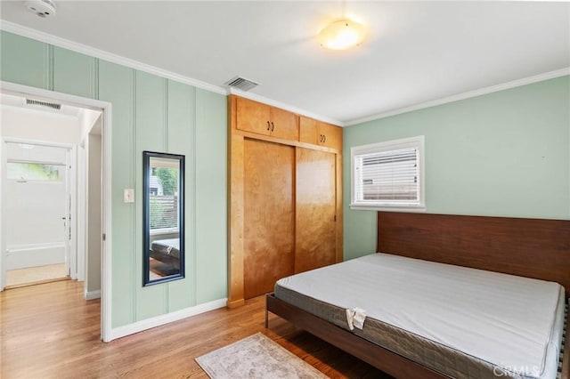 4514 Cedros Ave, Sherman Oaks, CA 91403 - bedroom with ornamental molding, light wood-style floors, and a closet