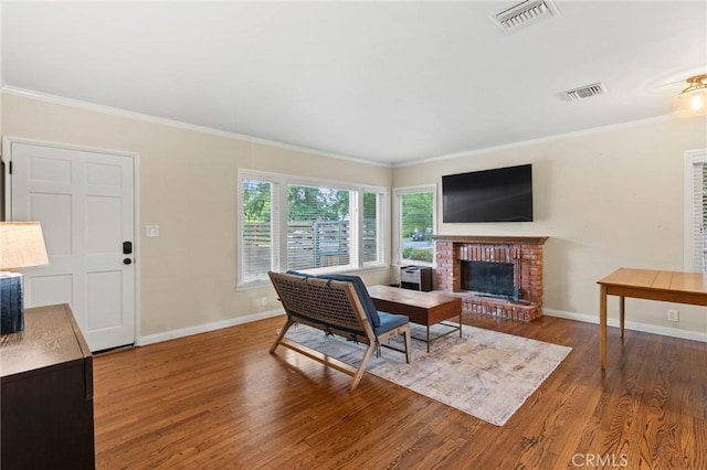 4514 Cedros Ave, Sherman Oaks, CA 91403 - living room featuring wood finished floors, crown molding, and a fireplace