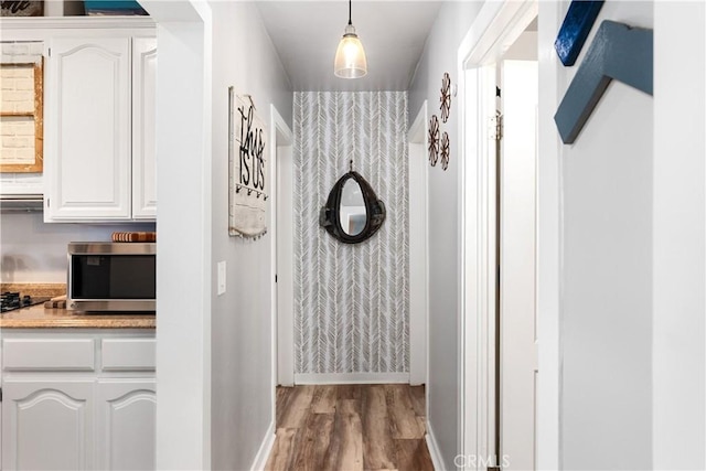 402 E St, Orland, CA 95963 - hallway featuring wood finished floors and baseboards
