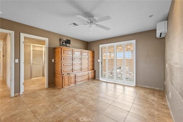 58960 Delano Trl, Yucca Valley, CA 92284 - unfurnished bedroom with a wall mounted air conditioner, access to exterior, light tile patterned floors, and a ceiling fan