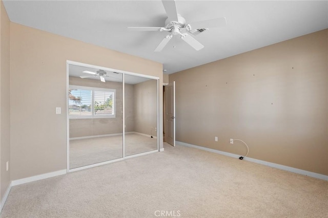 58960 Delano Trl, Yucca Valley, CA 92284 - unfurnished bedroom featuring carpet, a closet, and a ceiling fan