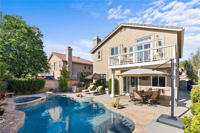 27811 Bloomfield Ct, Valencia, CA 91354 - back of property featuring a balcony, a fenced backyard, a patio, and stucco siding