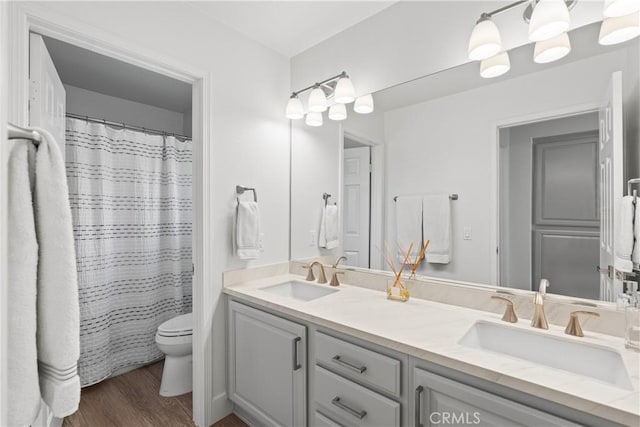 27811 Bloomfield Ct, Valencia, CA 91354 - bathroom with double vanity, wood finished floors, and curtained shower