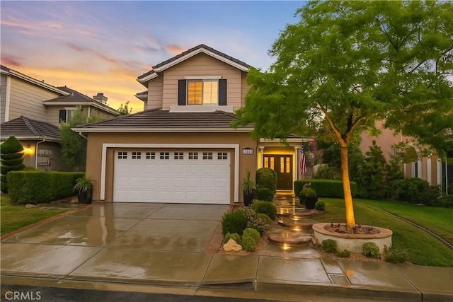 27811 Bloomfield Ct, Valencia, CA 91354 - traditional home with french doors, a garage, concrete driveway, a tile roof, and stucco siding