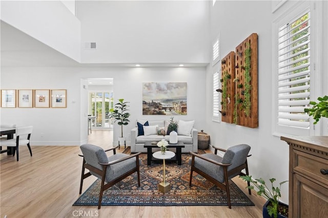 27811 Bloomfield Ct, Valencia, CA 91354 - living room featuring light wood-style flooring and a towering ceiling