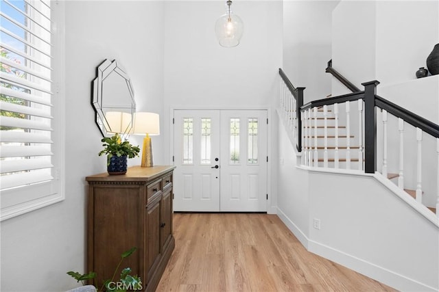 27811 Bloomfield Ct, Valencia, CA 91354 - entrance foyer featuring light wood finished floors, stairs, and a towering ceiling