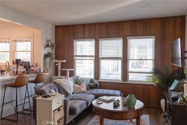 1517 E 1st St, Long Beach, CA 90802 - living area with healthy amount of natural light, wood walls, and dark wood-type flooring