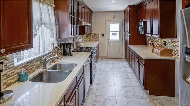 6418 Whitman Ave, Van Nuys, CA 91406 - kitchen featuring light marble finish flooring, appliances with stainless steel finishes, backsplash, light countertops, and recessed lighting