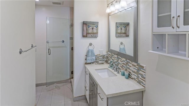 6418 Whitman Ave, Van Nuys, CA 91406 - full bath with vanity, decorative backsplash, a shower stall, and tile patterned floors