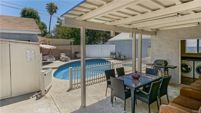 6418 Whitman Ave, Van Nuys, CA 91406 - view of swimming pool with washer / dryer, a fenced backyard, and a patio