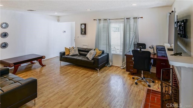 6418 Whitman Ave, Van Nuys, CA 91406 - living room featuring an office area, wood finished floors, a textured ceiling, and recessed lighting