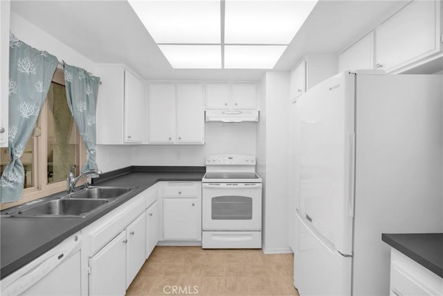 8777 Coral Springs Ct Unit 7H, Huntington Beach, CA 92646 - kitchen with white appliances, under cabinet range hood, white cabinets, and dark countertops