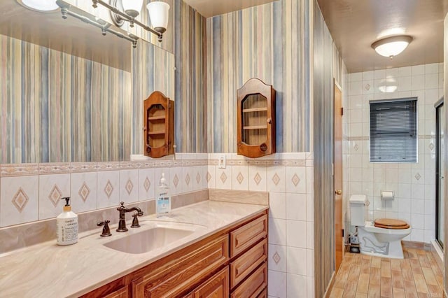 1106 Dawnridge Ave, El Cajon, CA 92021 - bathroom with tile walls, vanity, an enclosed shower, wallpapered walls, and wood finished floors