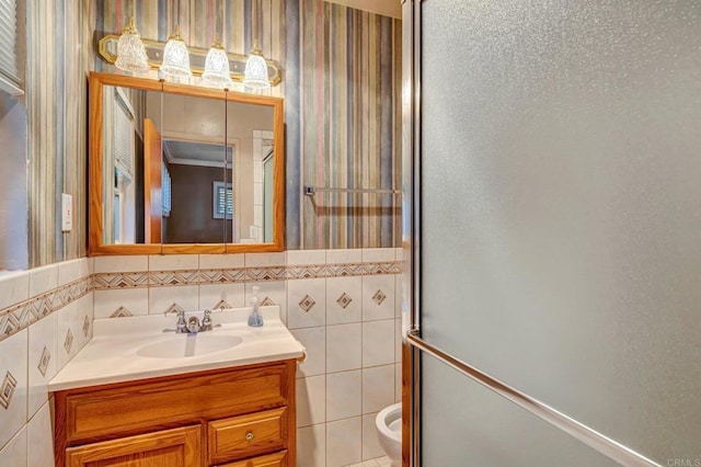 1106 Dawnridge Ave, El Cajon, CA 92021 - full bath with wallpapered walls, vanity, wainscoting, tile walls, and an enclosed shower
