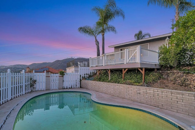 1106 Dawnridge Ave, El Cajon, CA 92021 - view of pool with a wooden deck and a fenced backyard