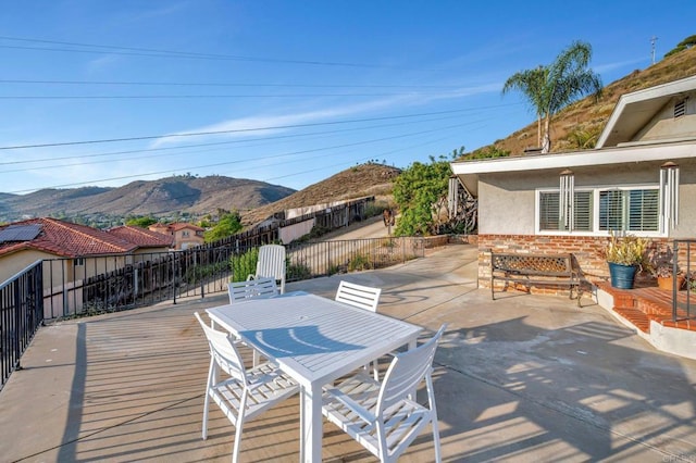 1106 Dawnridge Ave, El Cajon, CA 92021 - deck featuring a mountain view, outdoor dining space, and a patio