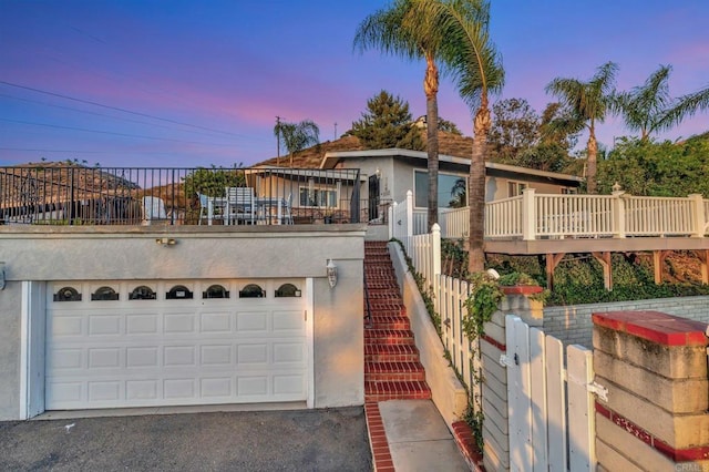 1106 Dawnridge Ave, El Cajon, CA 92021 - view of front of home featuring stucco siding, a garage, and driveway