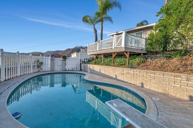 1106 Dawnridge Ave, El Cajon, CA 92021 - view of swimming pool featuring a wooden deck and a fenced backyard