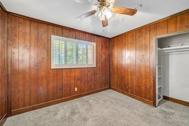 1106 Dawnridge Ave, El Cajon, CA 92021 - unfurnished bedroom featuring carpet floors, wooden walls, and ceiling fan