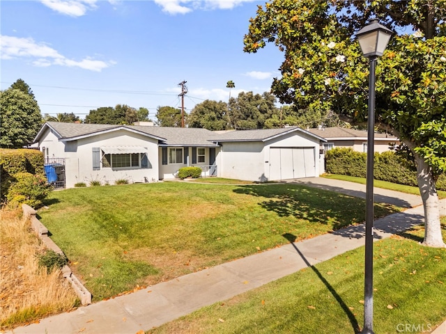3551 Brynhurst Dr, Riverside, CA 92504 - ranch-style house featuring driveway, an attached garage, a front lawn, and stucco siding