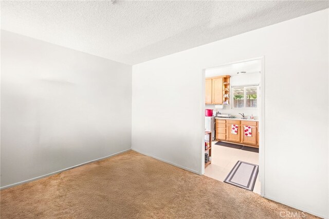 3551 Brynhurst Dr, Riverside, CA 92504 - empty room with light colored carpet and a textured ceiling
