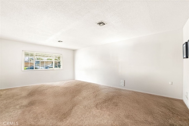 3551 Brynhurst Dr, Riverside, CA 92504 - carpeted spare room with a textured ceiling