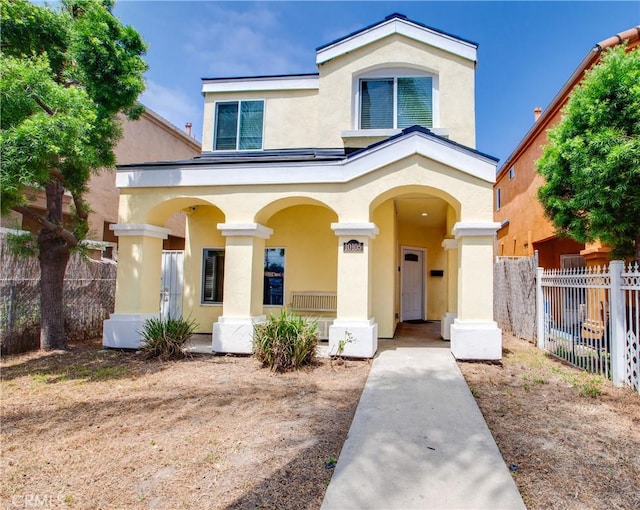 10105 S Main St, Los Angeles, CA 90003 - view of front of house with stucco siding and covered porch
