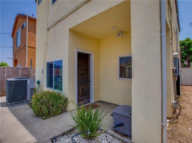 10105 S Main St, Los Angeles, CA 90003 - doorway to property featuring stucco siding