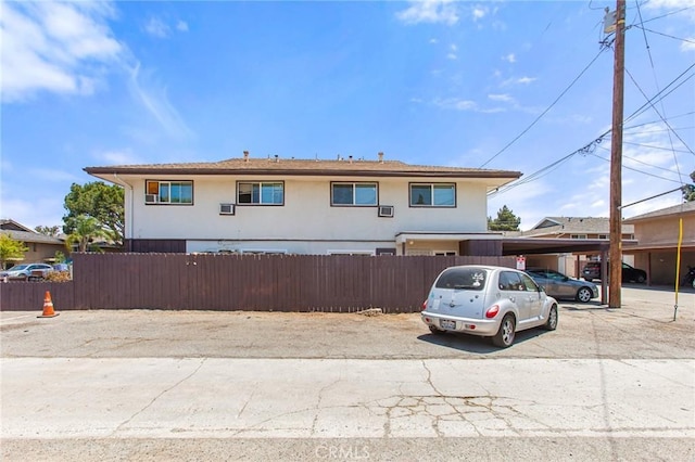 1270 W 9th St, Corona, CA 92882 - view of front facade featuring covered parking and stucco siding