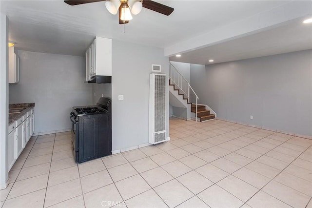 1270 W 9th St, Corona, CA 92882 - kitchen featuring gas range oven, a heating unit, a ceiling fan, recessed lighting, and white cabinetry