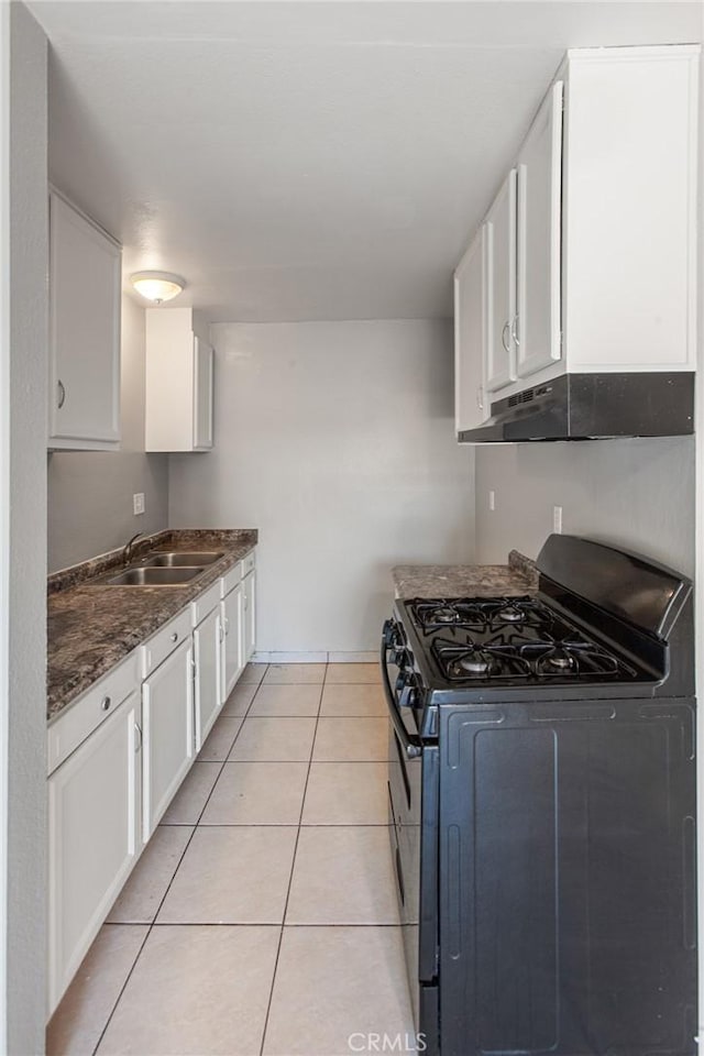 1270 W 9th St, Corona, CA 92882 - kitchen featuring stainless steel range with gas stovetop, under cabinet range hood, and white cabinetry
