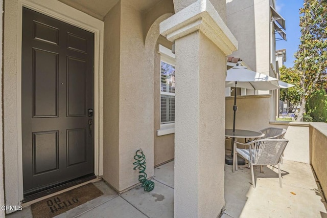 3366 Shadetree Way, Camarillo, CA 93012 - view of exterior entry featuring stucco siding and outdoor dining space