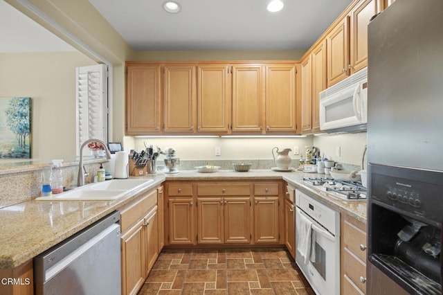 3366 Shadetree Way, Camarillo, CA 93012 - kitchen with appliances with stainless steel finishes, recessed lighting, light stone counters, light brown cabinetry, and a peninsula