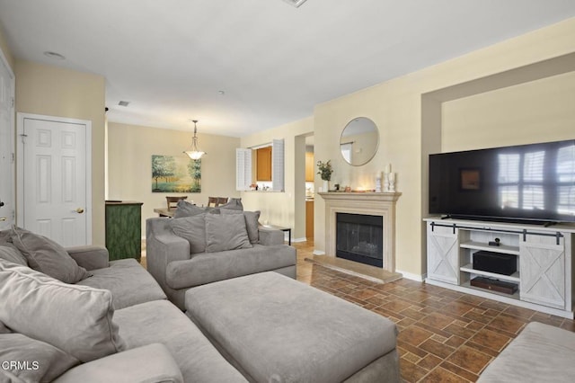 3366 Shadetree Way, Camarillo, CA 93012 - living room with a glass covered fireplace and dark stone finish flooring