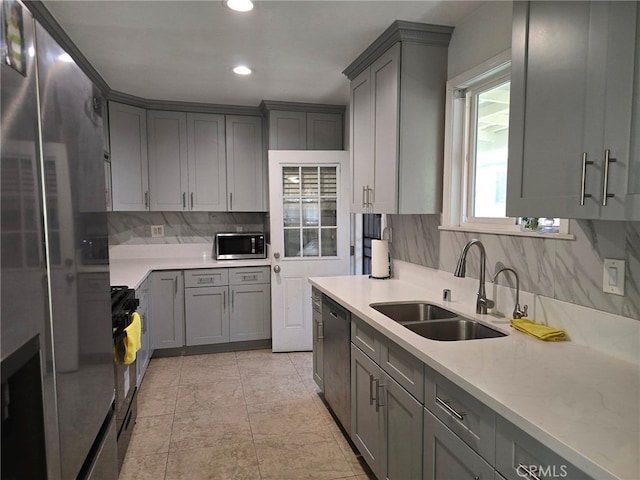 15768 Amar Rd, La Puente, CA 91744 - kitchen featuring appliances with stainless steel finishes, gray cabinetry, tasteful backsplash, and recessed lighting