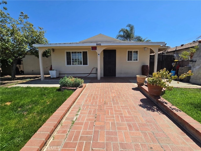 15768 Amar Rd, La Puente, CA 91744 - single story home with stucco siding and a patio area