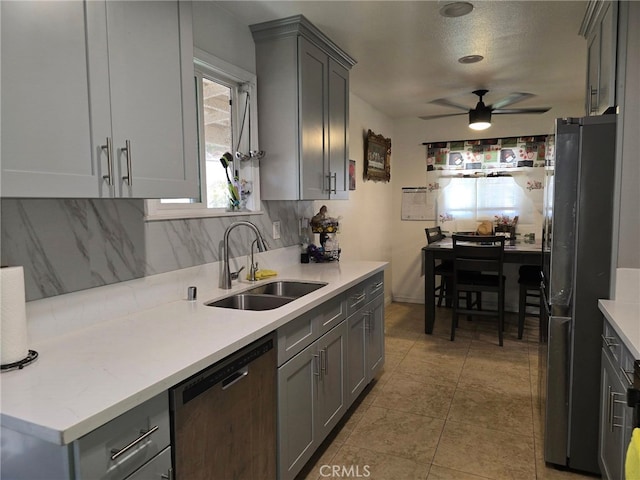 15768 Amar Rd, La Puente, CA 91744 - kitchen featuring dishwasher, freestanding refrigerator, gray cabinetry, decorative backsplash, and a ceiling fan